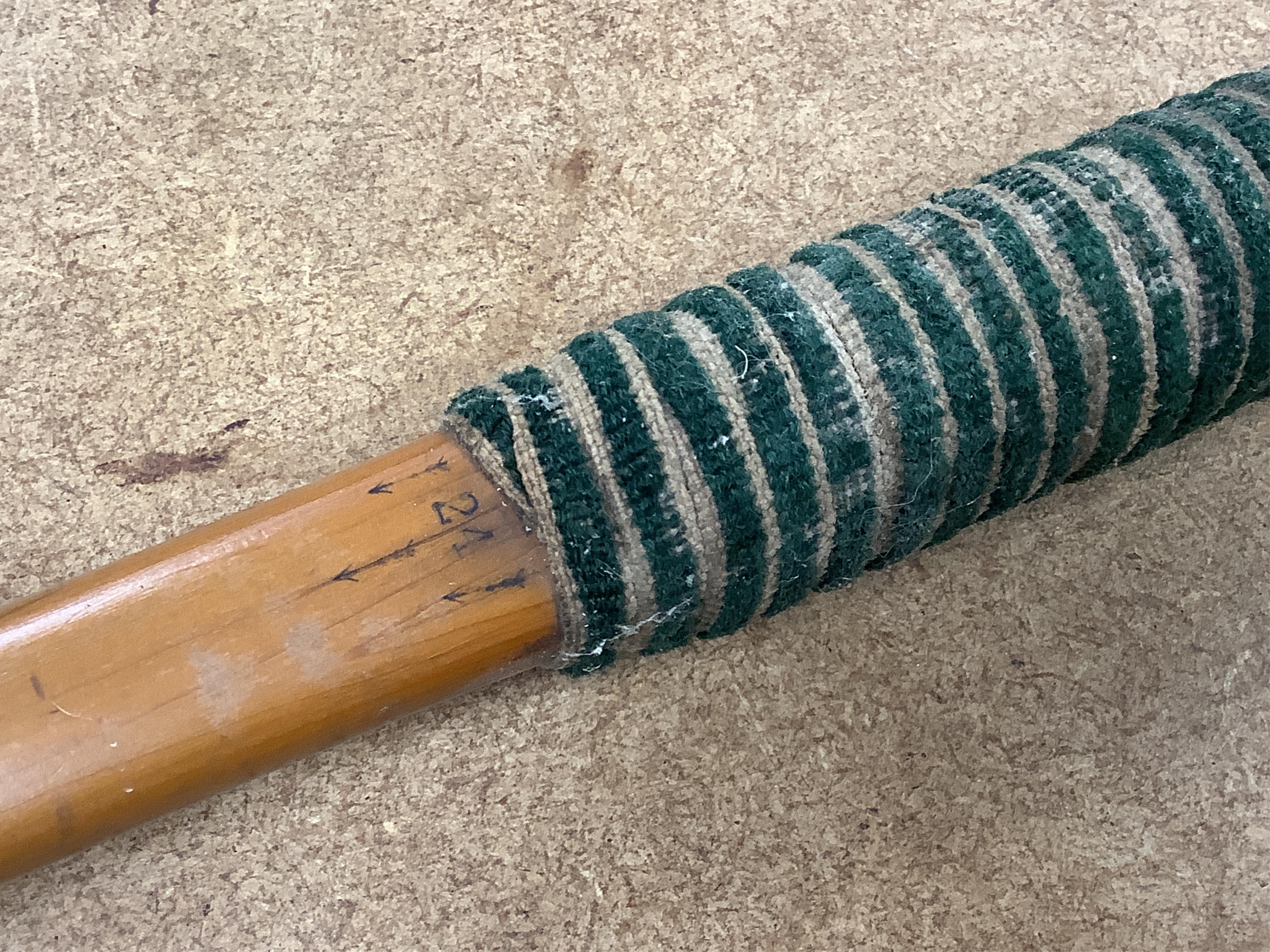 A collection of tribal spears, a fish hook, a cased snooker cue, etc.